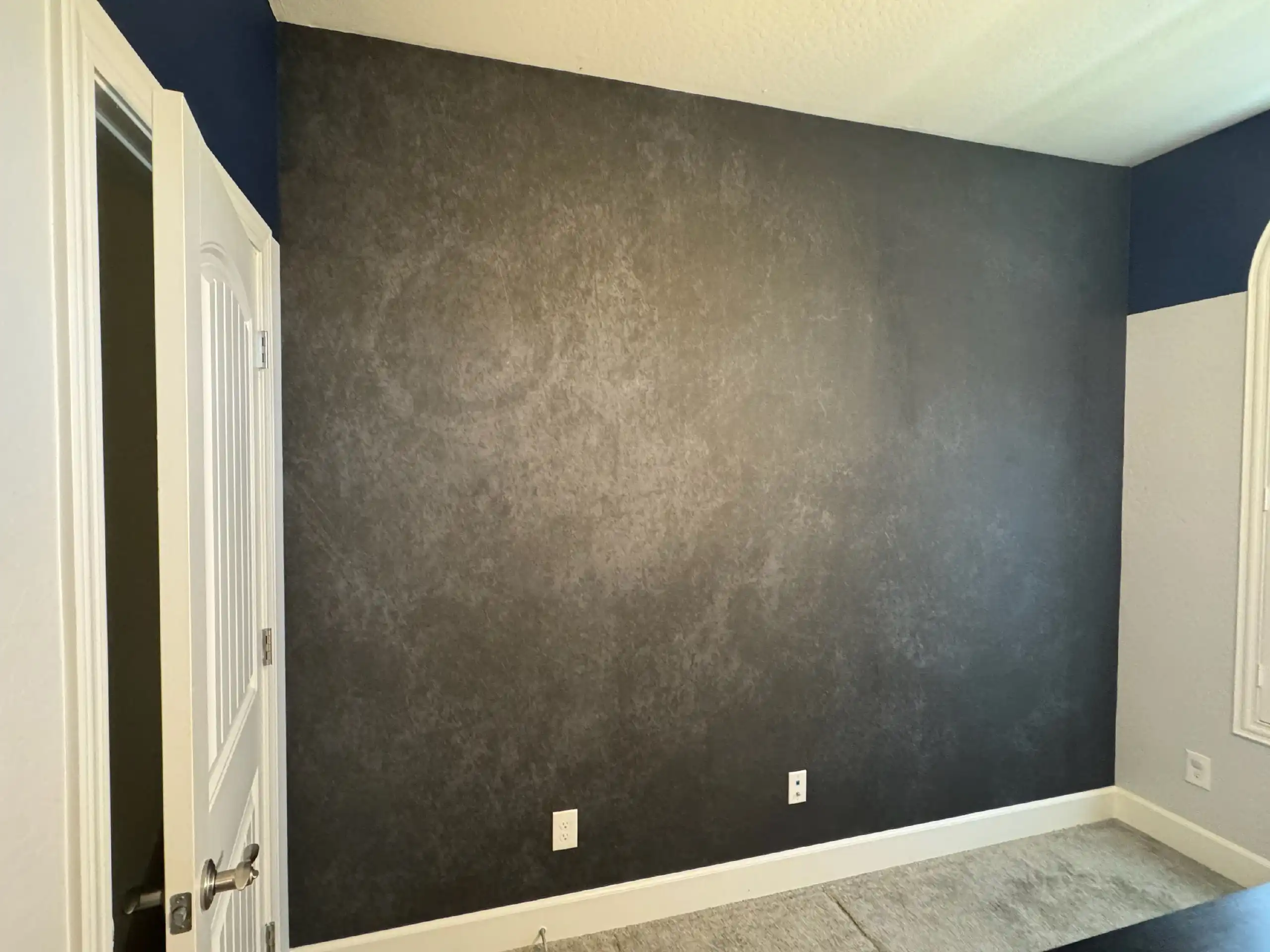 Residential feature wall with patterned wallpaper installed perfectly